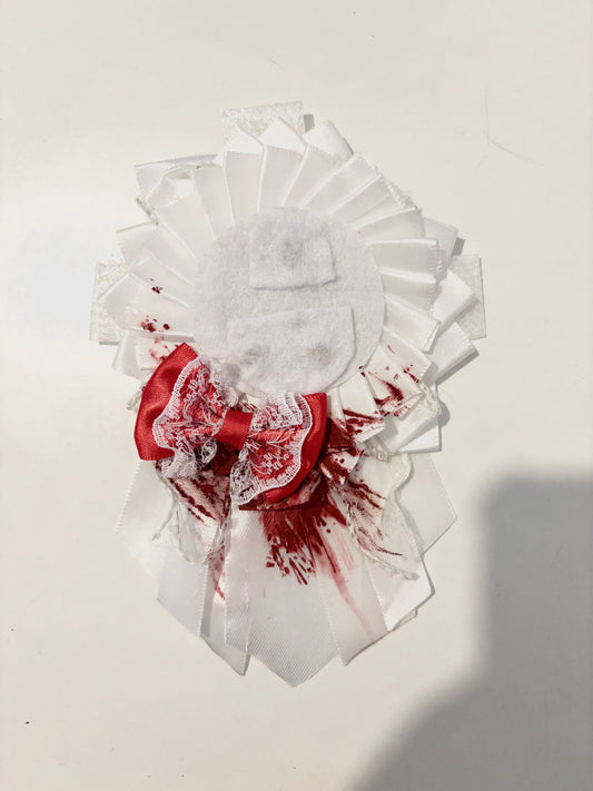 white blood-stained rosette