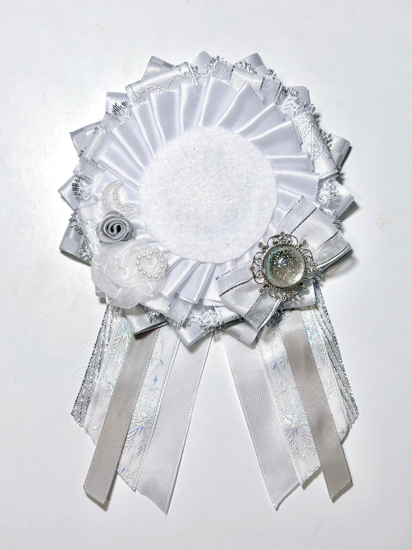 white and silver rosettte
